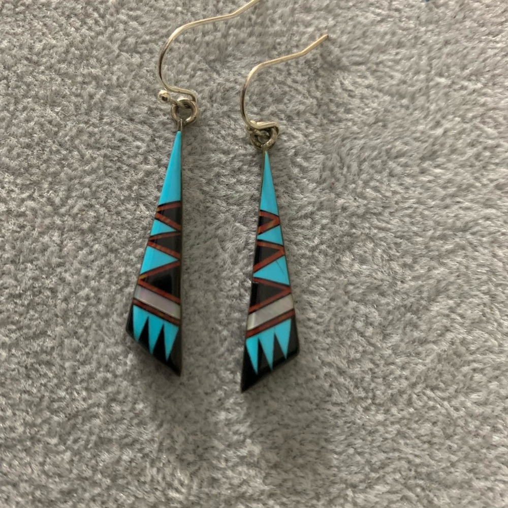 Sterling Silver dangling earrings.